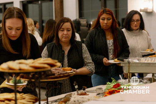 Attendees of the Women in Business event grabbing their food from Vidalia's Cafe and Catering.